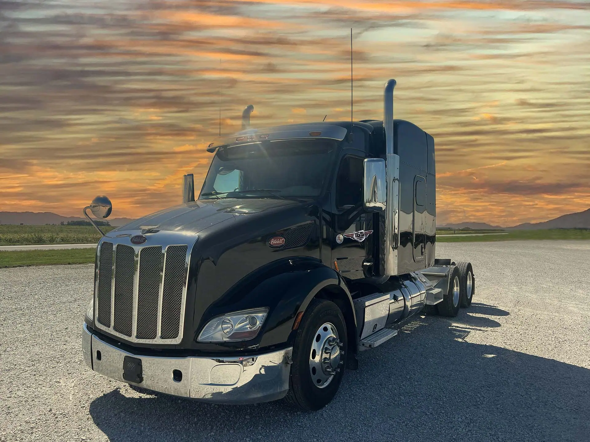I65 Transport Peterbilt 579 parked at sunset outside the Wolcott, Indiana terminal